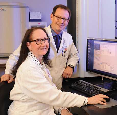 Dr. Margie Morgan with Jonathan Grein, MD, infectious disease specialist and associate director of hospital epidemiology at Cedars-Sinai. With its MALDI-TOF, the microbiology lab has seen an 18-hour decrease in the time for reporting identification of enteric Gram-negative rods.