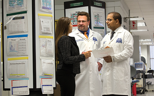 Dr. Sharma and Copeland, of the Henry Ford Health System, have worked with clinical microbiology associate director Robert Tibbetts, PhD (center), on many laboratory analytics projects, including the evaluation of MALDI-TOF’s downstream impact on lengths of stay and patient costs.