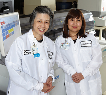 Dr. Valerie Ng (left) with Highland Hospital laboratory operations manager Feuy Saechao. Dr. Ng’s advice for point-of-care coordinators: “Don’t overthink risk assessment.”