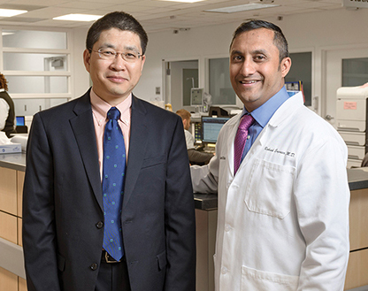 The Cleveland Clinic went live with Roche’s TnT Gen 5 Stat assay in June. “The only way to make a smooth transition is to have a team composed of all the stakeholders,” says Dr. Sihe Wang (left), here with emergency medicine physician Rakesh Engineer, MD.