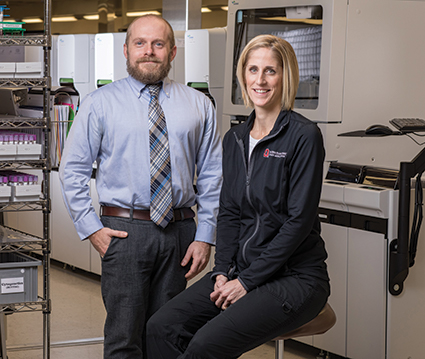 Dr. Steven Cotten with point-of-care coordinator Sara Enders, MT(ASCP), at Ohio State University Wexner Medical Center. They and others rolled out a program two years ago, called BRAVE, that defines criteria for when a capillary specimen is appropriate. “We consider the criteria clinical decision support related to proper device use,” Dr. Cotten says.