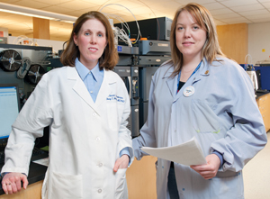 Dr. Stacy Melanson (left) with Alicia Darragh, senior medical technologist, toxicology. The lab at Brigham and Women’s is formalizing a pain toxicology consultative service. It’s doing five to 10 such consults monthly now, mostly with primary care physicians.