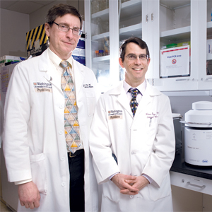 <em><strong>For warfarin pharmacogenetics testing</strong>, much rests on the results of the GIFT and COAG multicentered trials. Below, at Washington University, Dr. Charles Eby (left), medical director of the central labs for the trials, and Dr. Brian Gage, principal investigator for GIFT.</em>