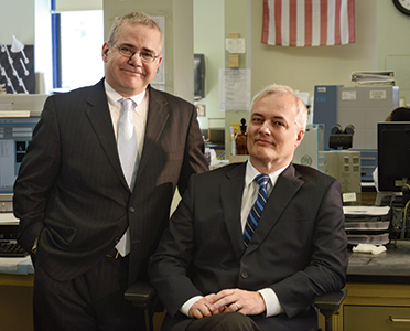Dr. Alexander Kratz (left) and Dr. Jorge Sepulveda at New York-Presbyterian Hospital, where the electronic medical record system and common desktop software are being used to make the operation of the laboratories more efficient.
