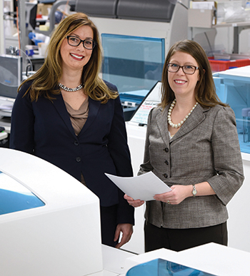 Dr. Nikola Baumann (left) and Darci Block, PhD, co-directors of Mayo Clinic’s central clinical laboratory. They and others are devising tools to help Mayo’s labs make risk assessment an easily documented process.