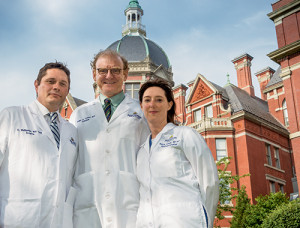 Dr. Anne Marie Lennon (above), who oversees the Multidisciplinary Pancreatic Cyst Clinic at Johns Hopkins, says colleagues such as Dr. Ralph Hruban (center) and Dr. Christopher Wolfgang (left) “bring huge depths of knowledge” to patient management discussions each week. “We all learn from each other.”