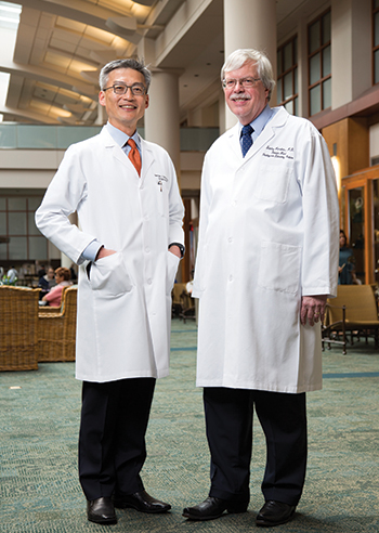 Dr. Stan Hamilton (right) at the University of Texas MD Anderson Cancer Center with George Chang, MD, MS, a professor in the Department of Surgical Oncology and chief of the section of colon and rectal surgery. The guideline on molecular biomarkers for the evaluation of colorectal cancer “has brought the quality control aspect [of testing] front and center,” says Dr. Hamilton.