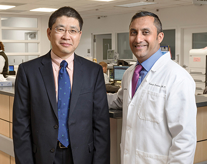 The Cleveland Clinic went live with Roche’s TnT Gen 5 Stat assay in June. “The only way to make a smooth transition is to have a team composed of all the stakeholders,” says Dr. Sihe Wang (left), here with emergency medicine physician Rakesh Engineer, MD.