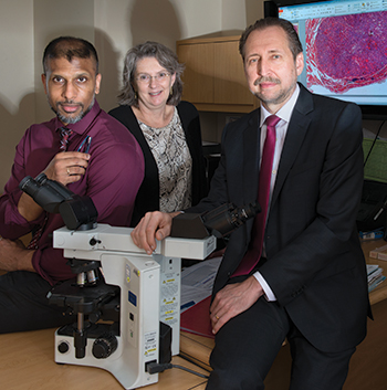 “Way overdue” is how many see the nomenclature revision for noninvasive encapsulated follicular variant of papillary thyroid carcinoma, says Dr. Yuri Nikiforov (right), with Dr. Sally Carty and Dr. Raja Seethala at UPMC.