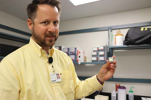 Dr. David Seidman of Sentara (with a GX5 sequencing chip used to perform NGS)